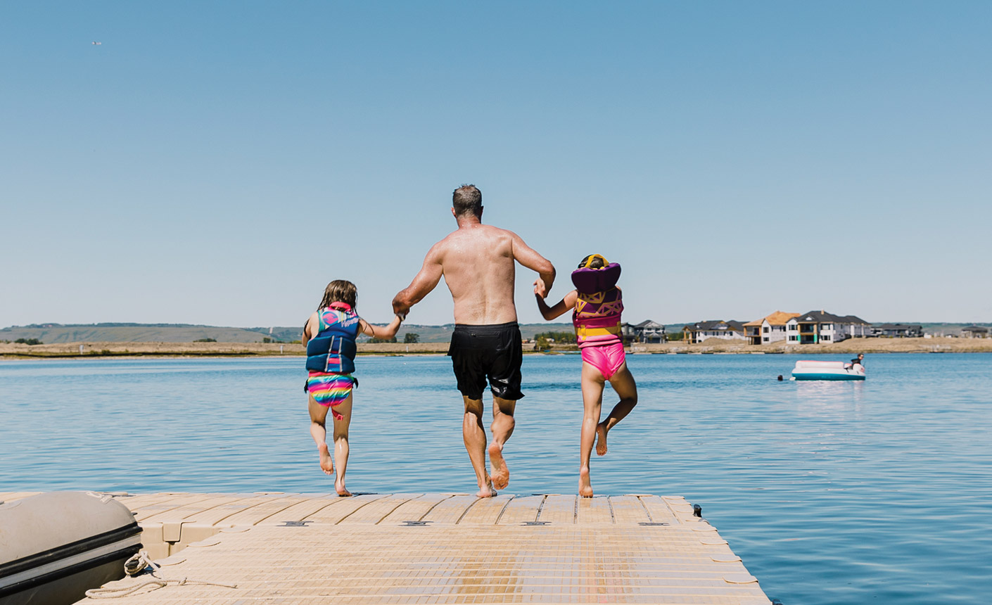 Family Jumping Off Dock