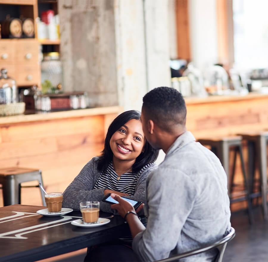 Man and woman having coffee at cafe