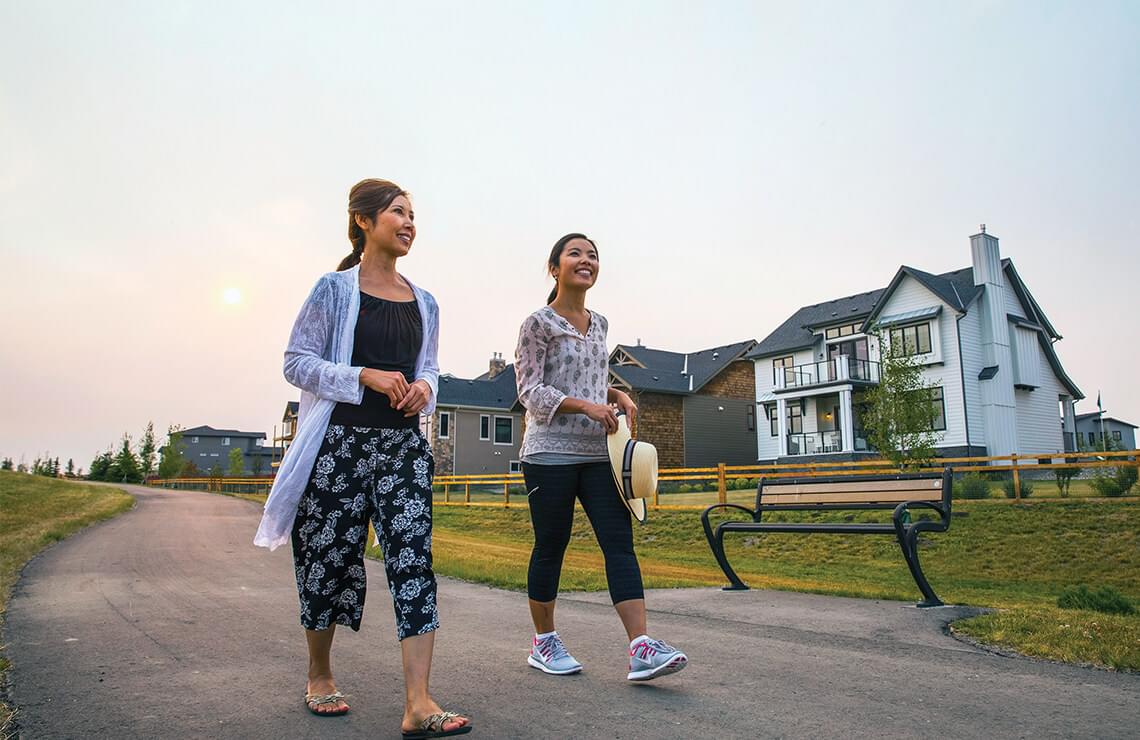 Two women walking along pathway