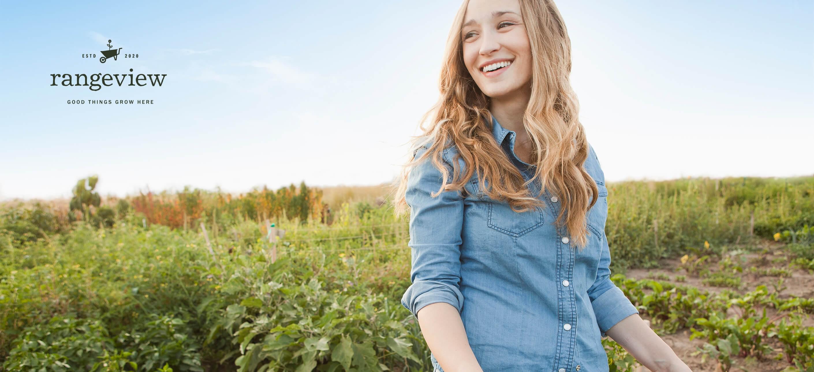 Woman standing in a community garden