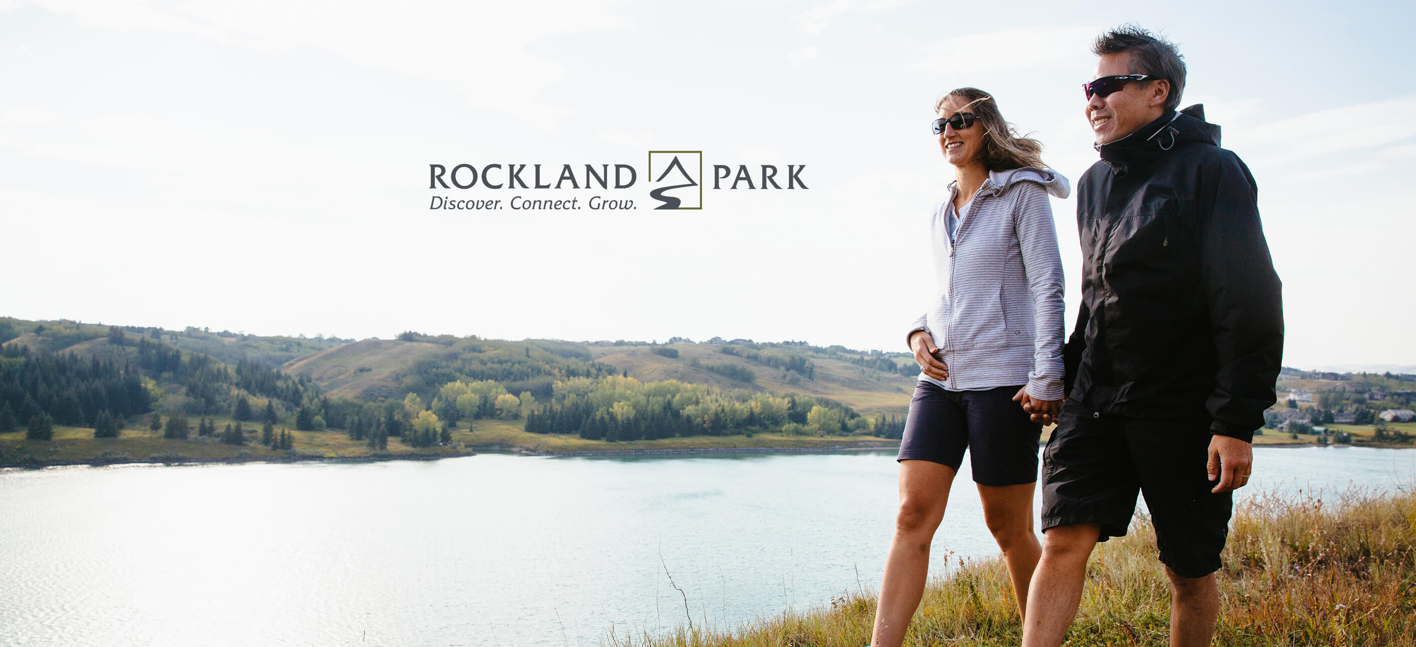 Couple holding hands on a walk through wetland area