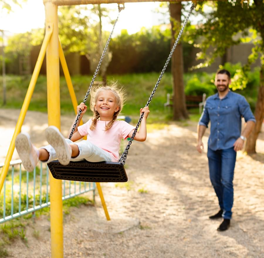 Smiling girl on the swing