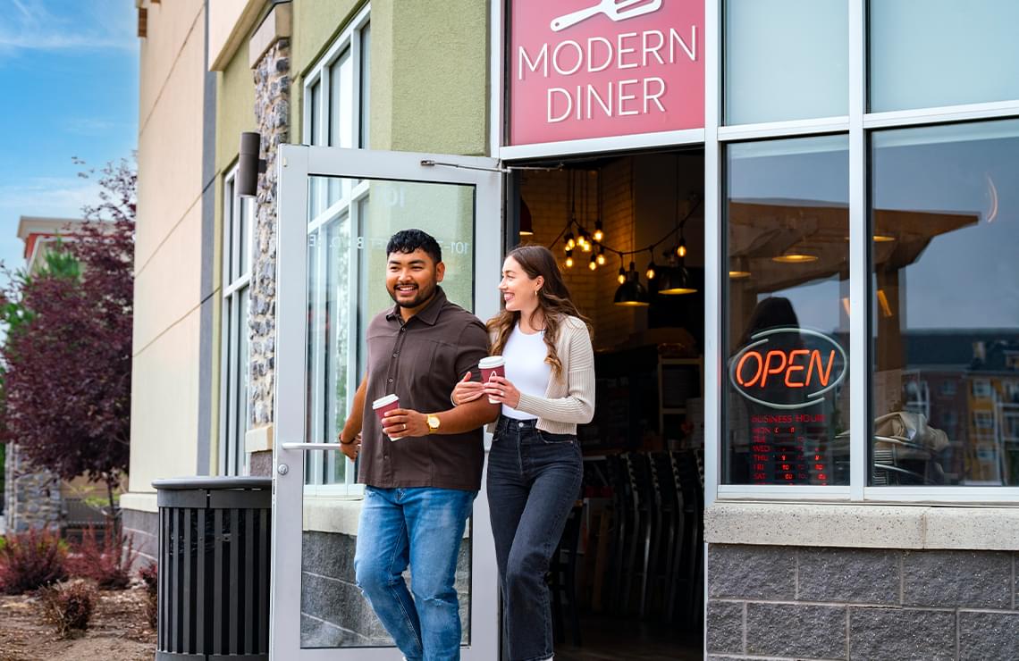 Man and woman having coffee at cafe