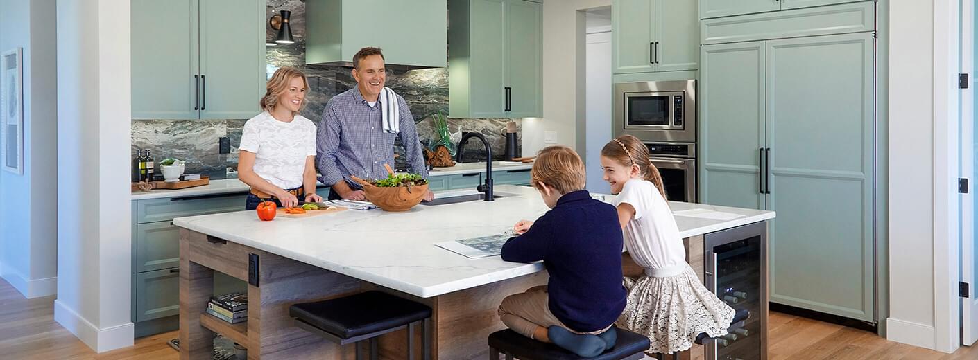 Couple preparing meal in a beautiful white kitchen